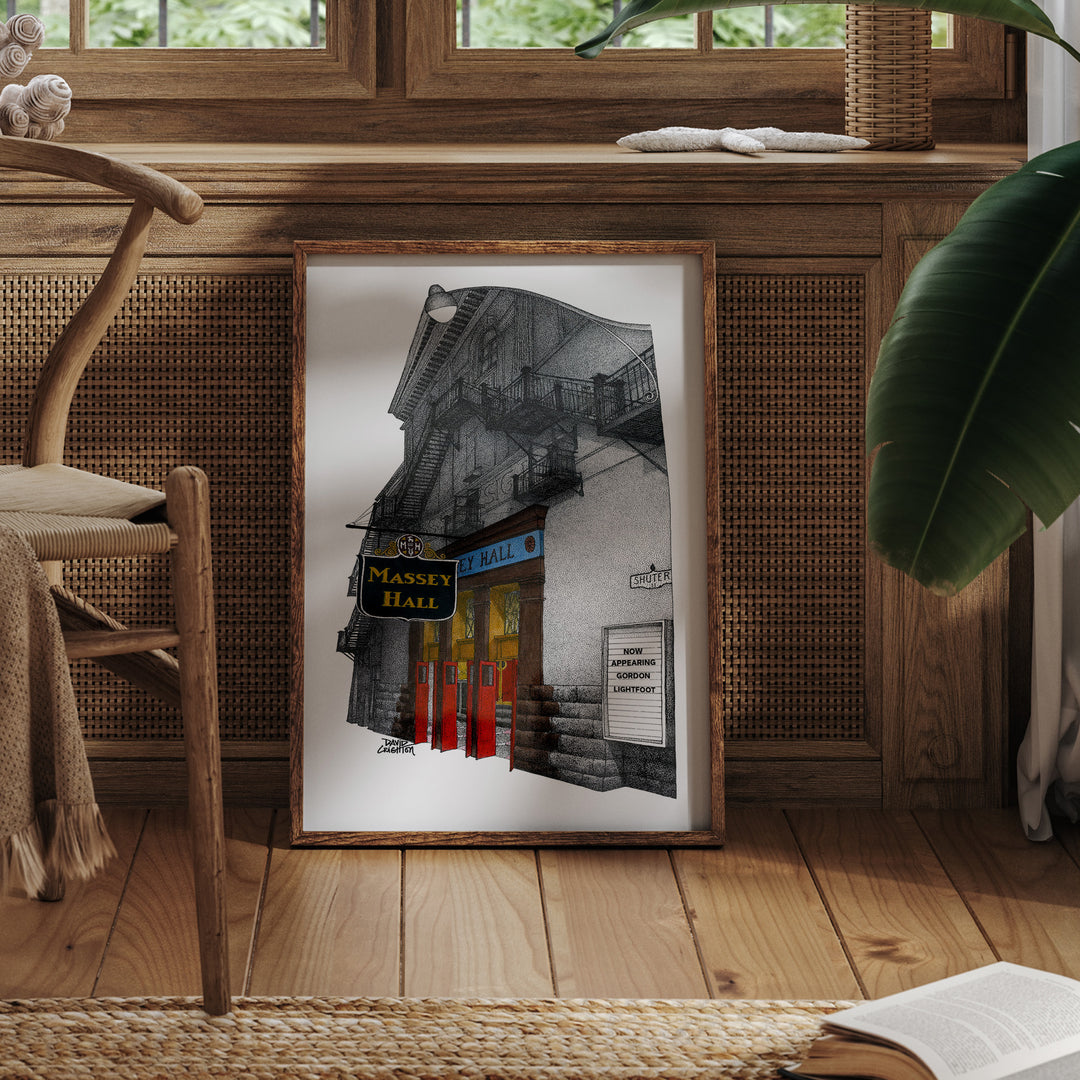 Framed Massey Hall Art Print leaning against a radiator in a room with a tropical plant