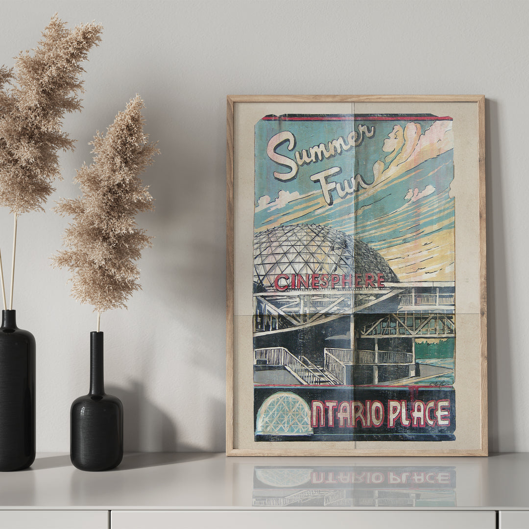 Ontario Place Toronto Poster by Rob Croxford in a wooden frame on drawer with black mantel bottle