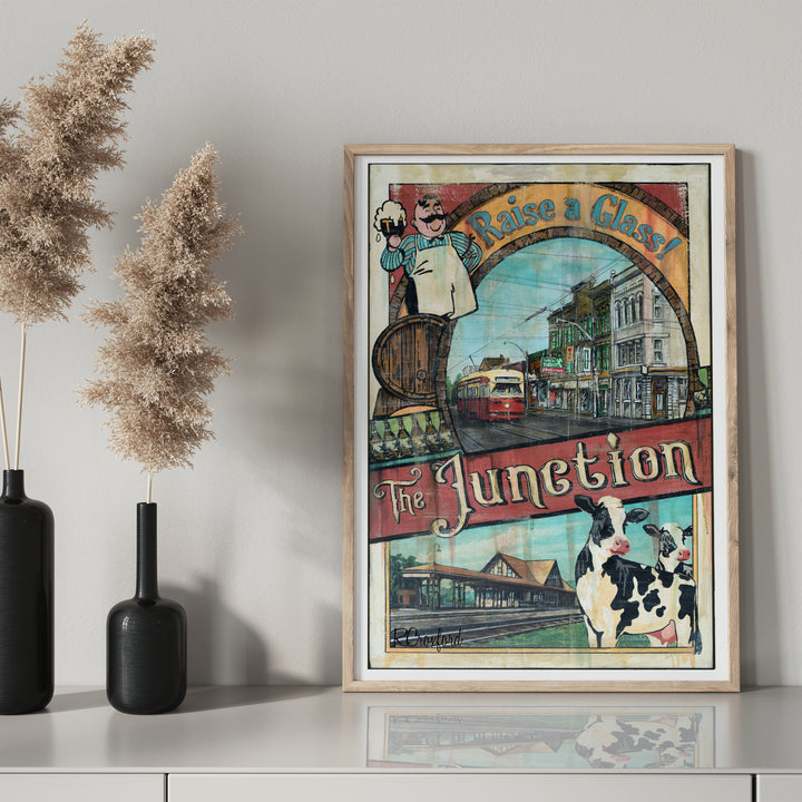 The Junction Toronto Poster by Rob Croxford in wooden frame with black mantel bottle