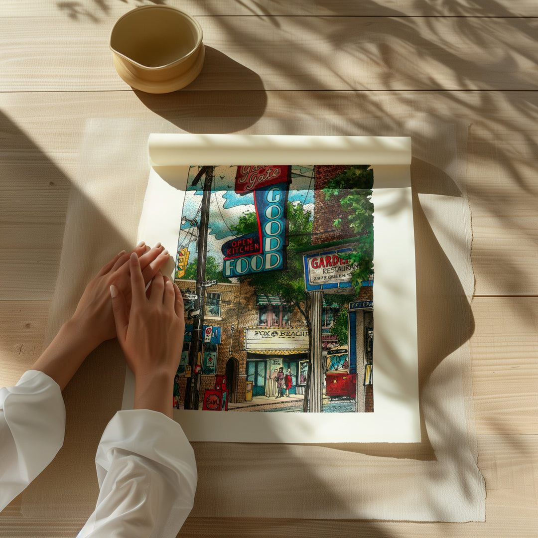 Beautiful illustration of The Goof Garden Gate from Toronto Art Shop on a wooden desk, dappled in sunlight. 