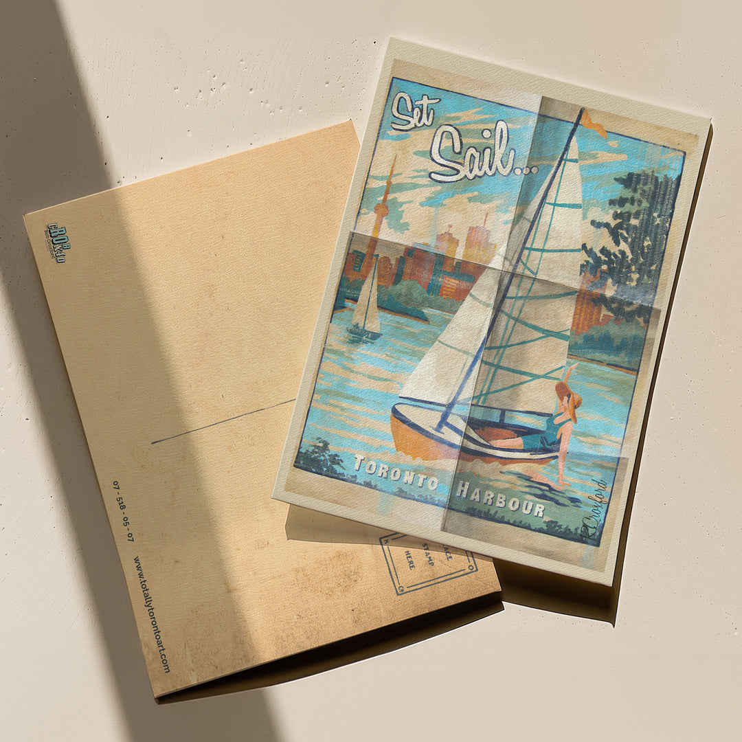 Set Sail Toronto Harbour Postcard by Rob Croxford with front and back of postcard on display