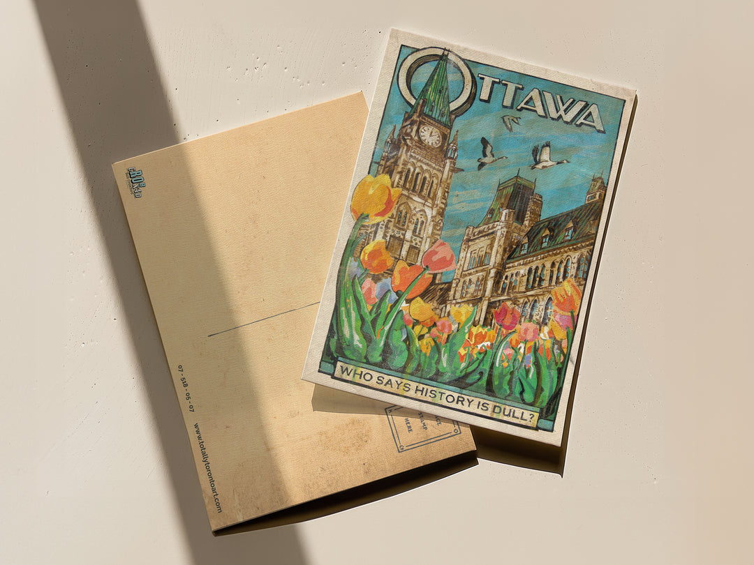 Ottawa Canada Postcard by Rob Croxford front and back of postcard visible on table