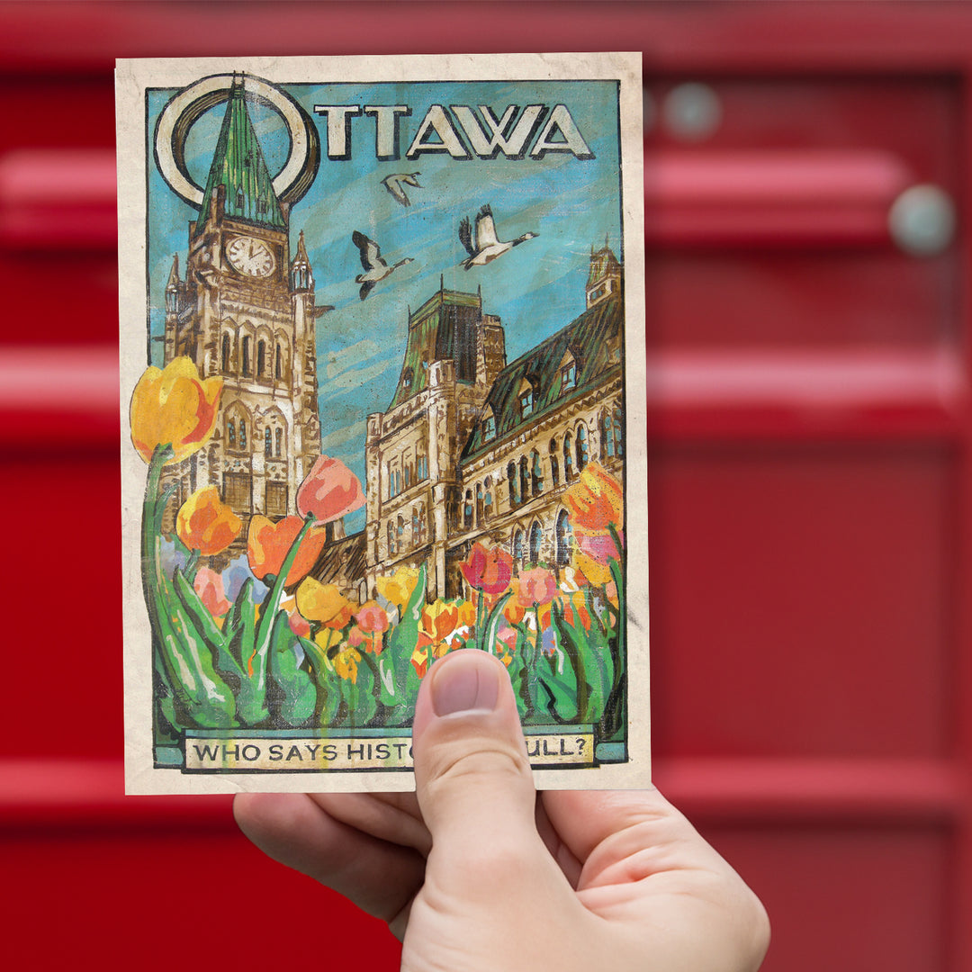 Ottawa Canada Postcard by Rob Croxford held up against red mailbox