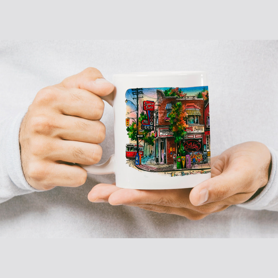 The Beaches Toronto Coffee Mug held by a man