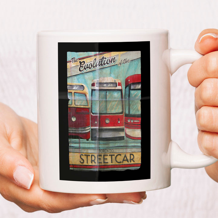 The Evolution of Torotno Streetcar Coffee Mug available at Totally Toronto Art