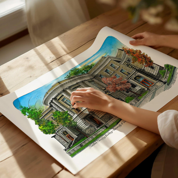 Beautiful illustration of University of Toronto Fleming Building from Toronto Art Shop on a wooden desk, dappled in sunlight. 