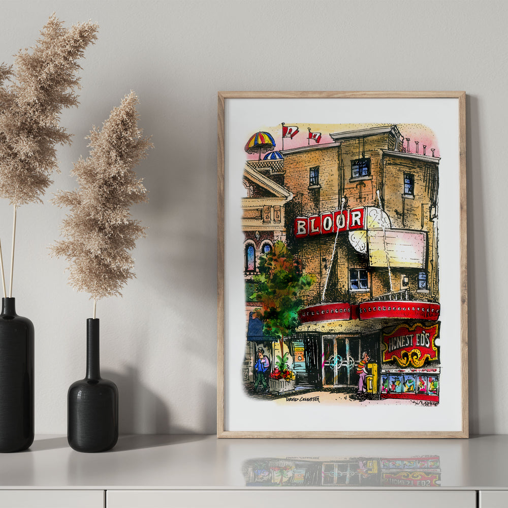 Bloor Cinema Poster in a glass frame with black mantel bottle 