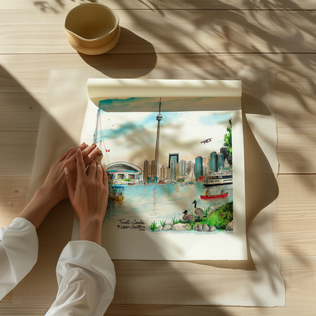 Beautiful illustration of Toronto Island Skyline from Toronto Art Shop on a wooden desk, dappled in sunlight. 