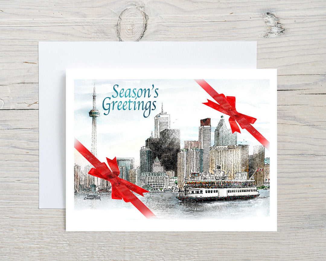 Toronto Seasons Greetings Christmas card feature the Skyline in the winter with bows