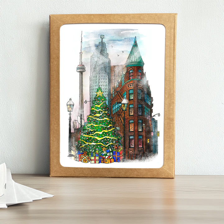 Flatiron Christmas Box Set with an image of the Flation on a snowy day with the CN Tower and a Xmas Tree