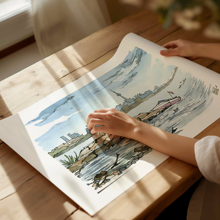 Toronto Skyline from the Island Toronto Poster being unrolled on sunlight dappled desk