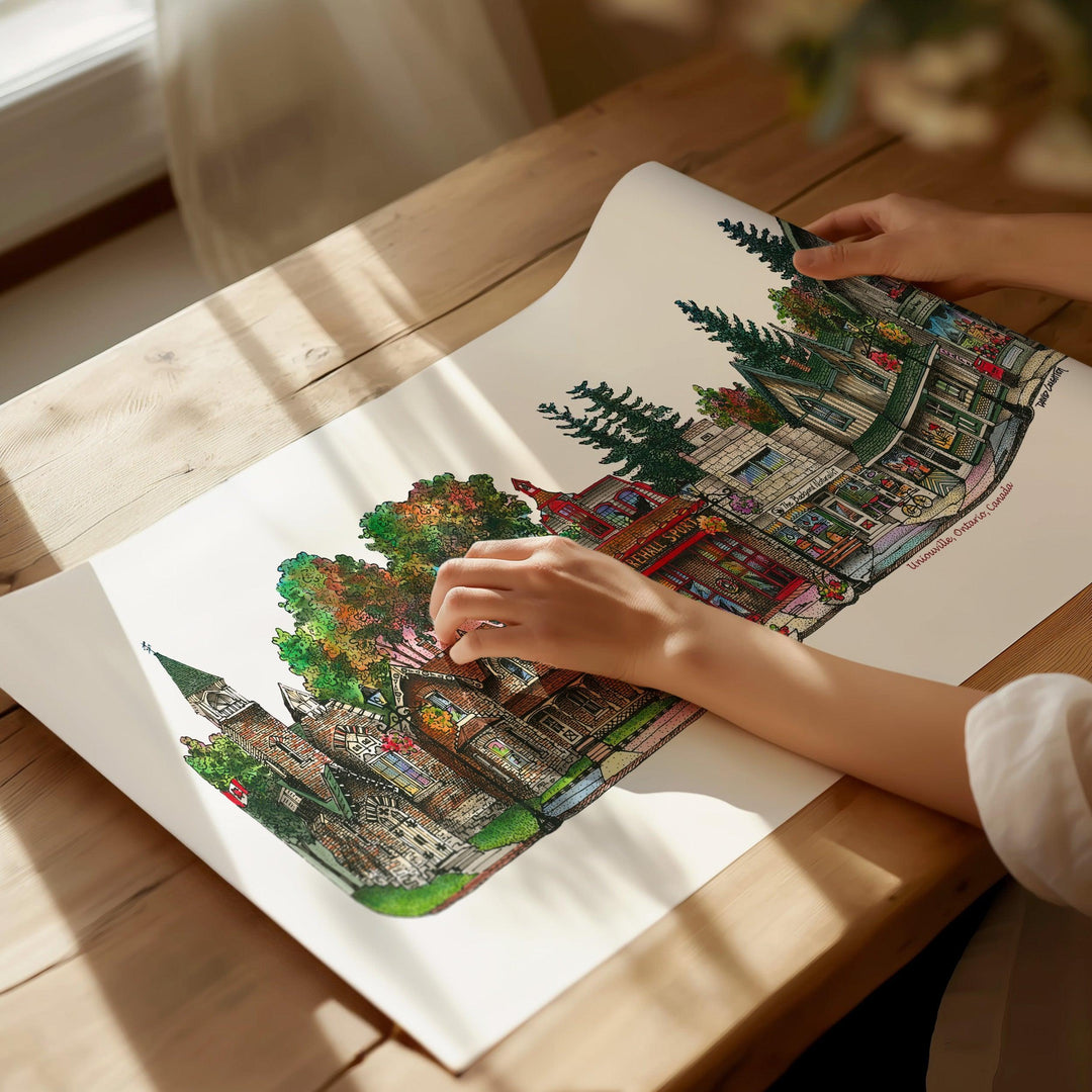 Beautiful illustration of Unionville Ontario Canada from Toronto Art Shop on a wooden desk, dappled in sunlight. 