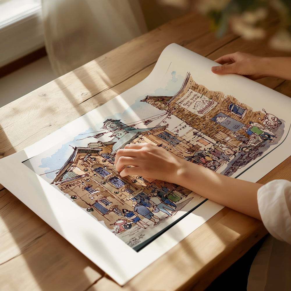 Distillery District Toronto Poster being unrolled on sunlight dappled desk