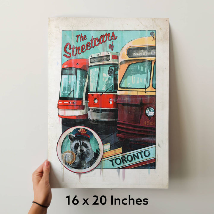 Raccoon Streetcar Toronto Art Print being held up by hand to scale 16x20''