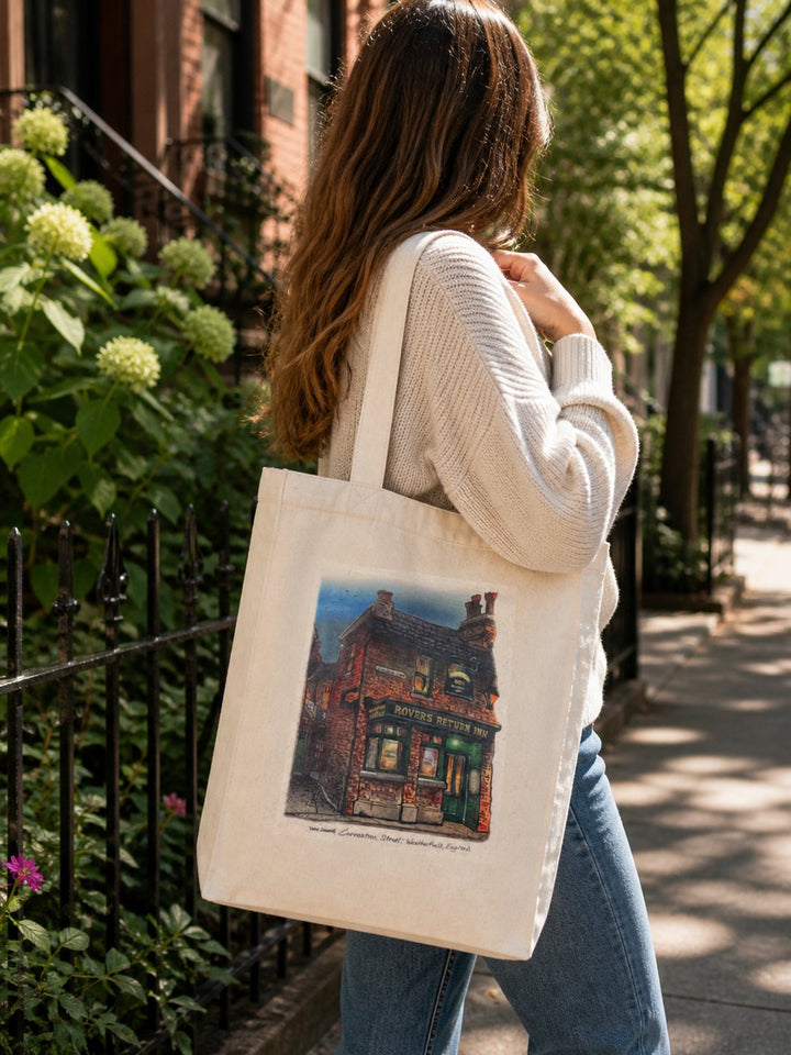Woman with Rovers Return Canvas Art Tote on her shoulder on a city street in the summer